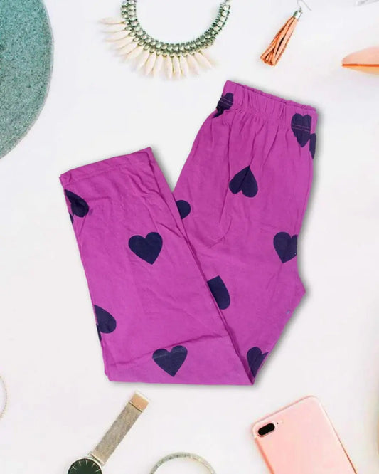 Shocking pink lounge trousers with a dark heart print.