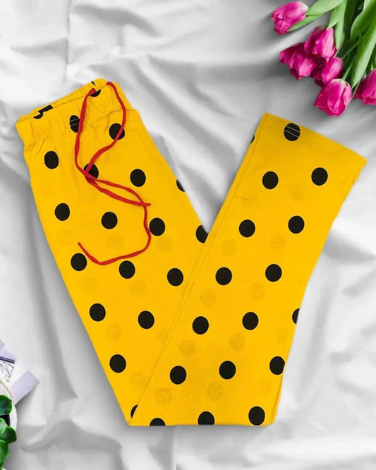Yellow lounge pants with a black polka dot print and a red drawstring.