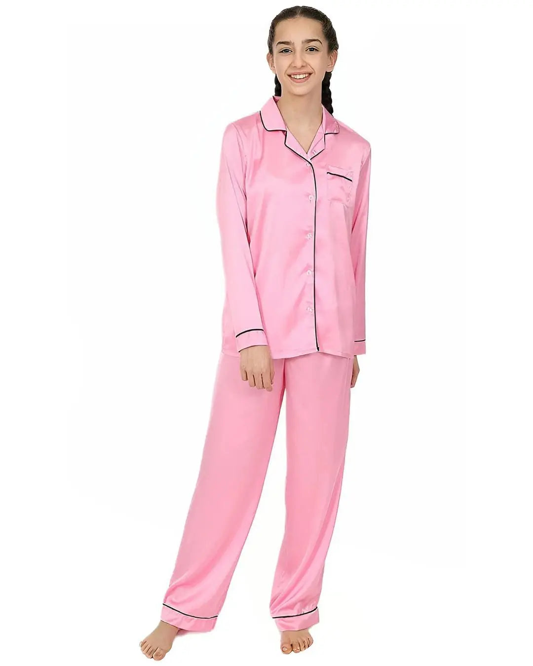 A full view of a baby pink silk pajama set, including a long-sleeve top and matching pants.