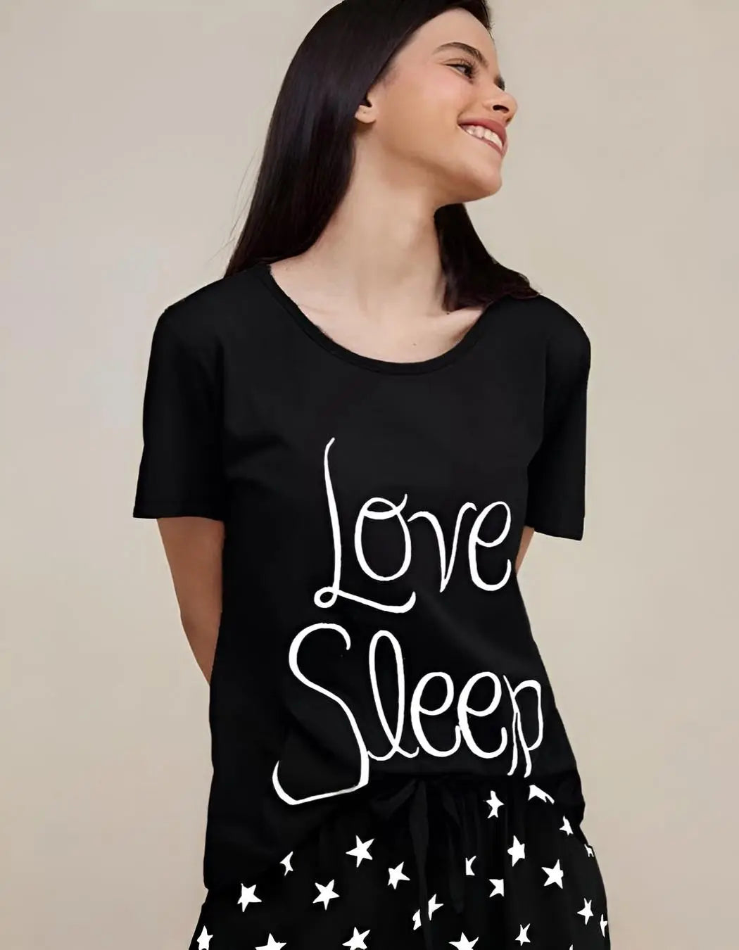 Image of a model wearing a Black Love Sleep Designs black night suit, styled for comfortable sleep and relaxation