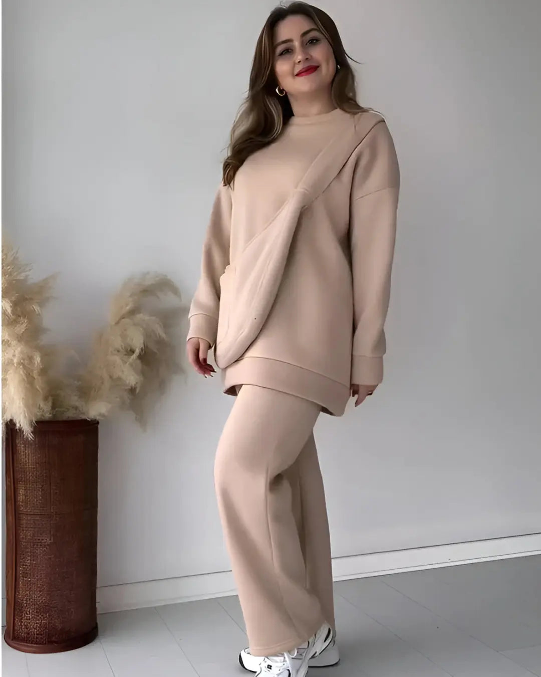 A full view of a winter co-ord set with a matching carryall bag, including a top and trousers.