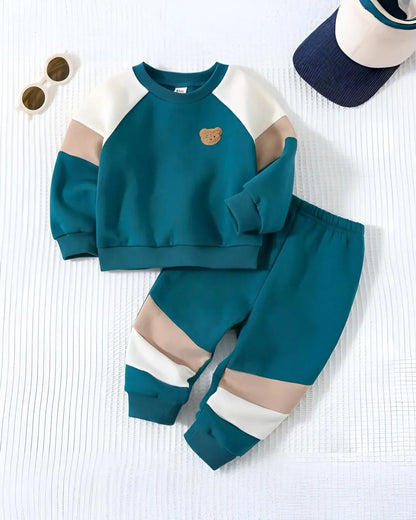 A kids' two-piece winter suit in a vibrant green color with a cute teddy 