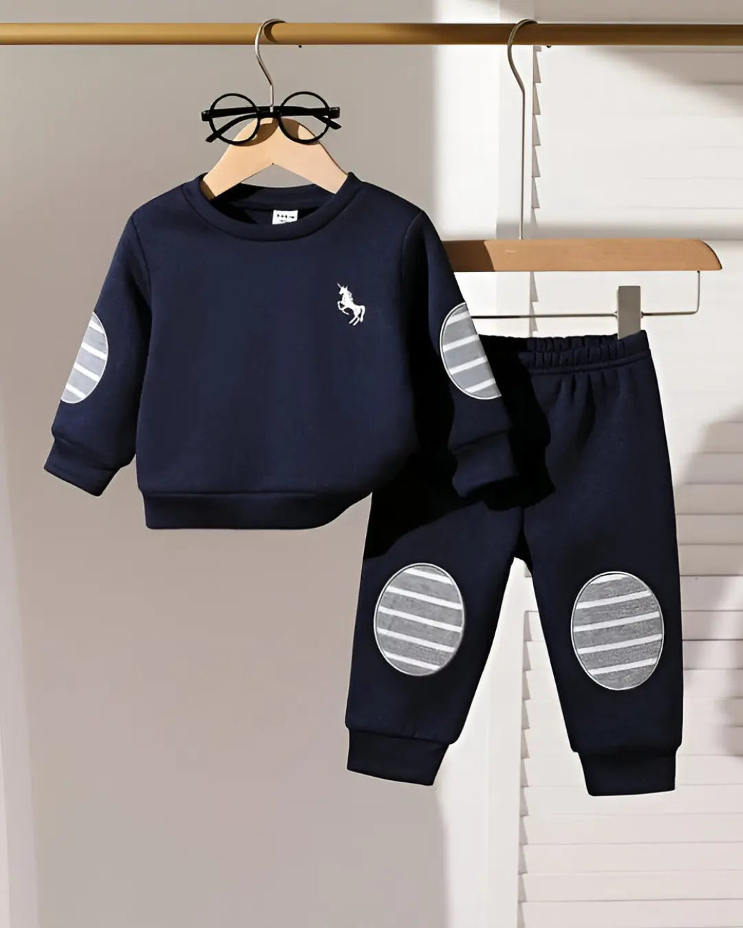 "Kids' winter fleece suit with navy blue horse print—a warm, cozy outfit for boys and girls"