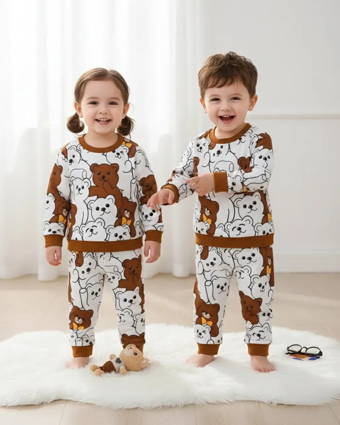 A kids' two-piece winter suit with a repeating print of brown and white bears.