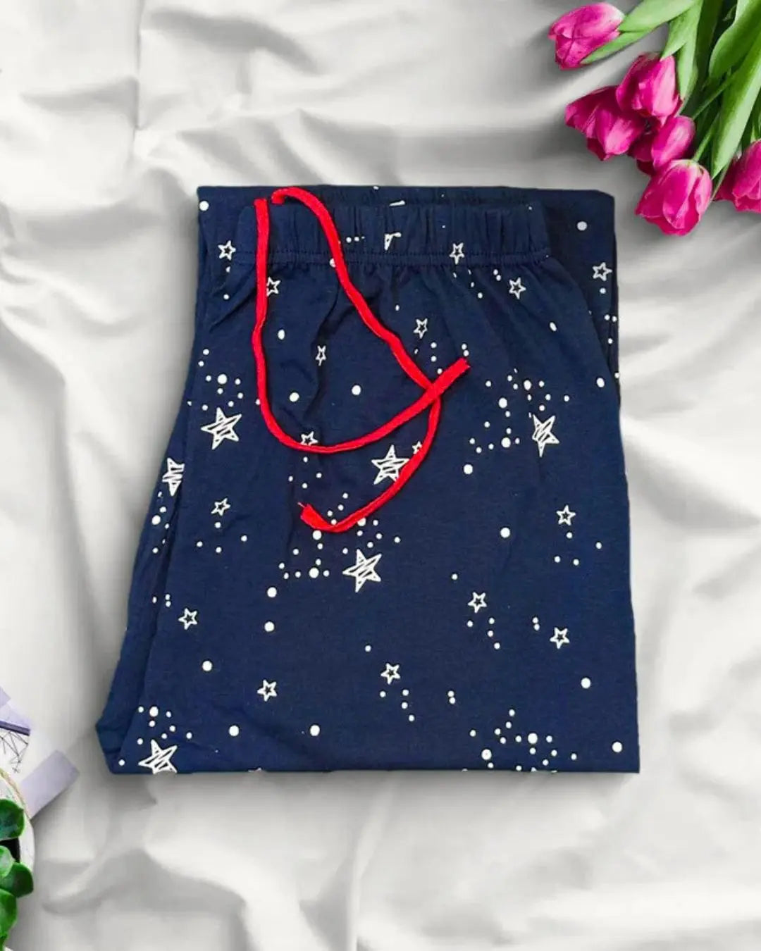 Navy blue galaxy print trousers, a comfortable pajama with star and dot pattern.