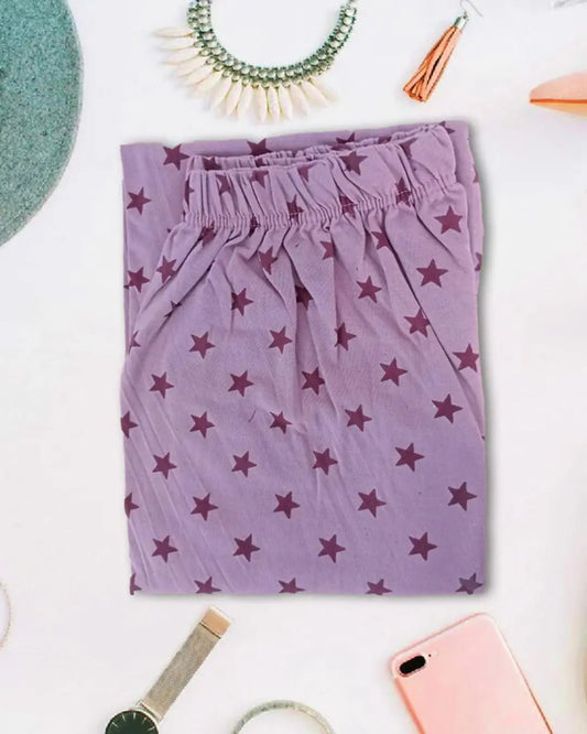 Dusty rose or mauve trousers with a cameo star print.