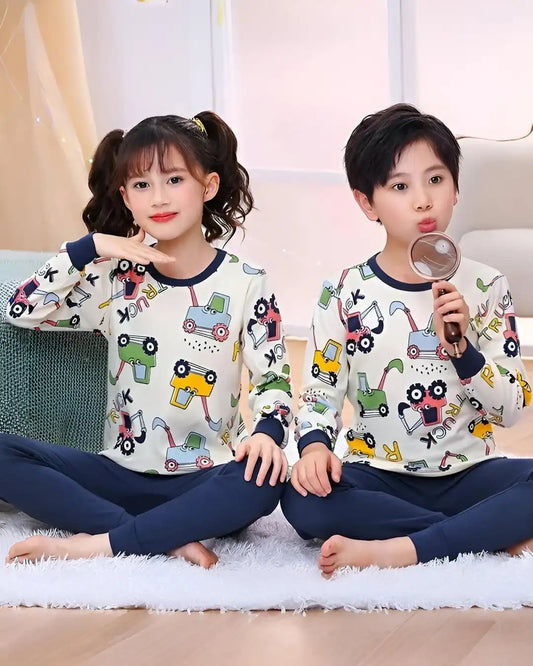 Multi-print tracksuit for kids, featuring colorful trucks on a soft fabric