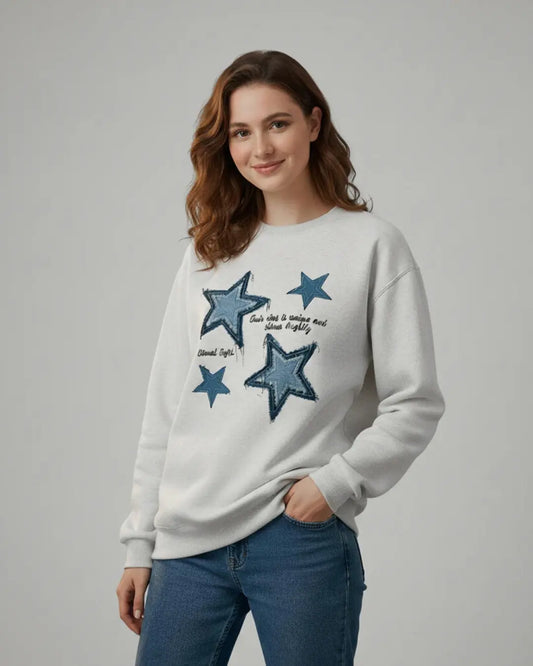 A stylish white fleece sweatshirt adorned with a charming winter stars print.