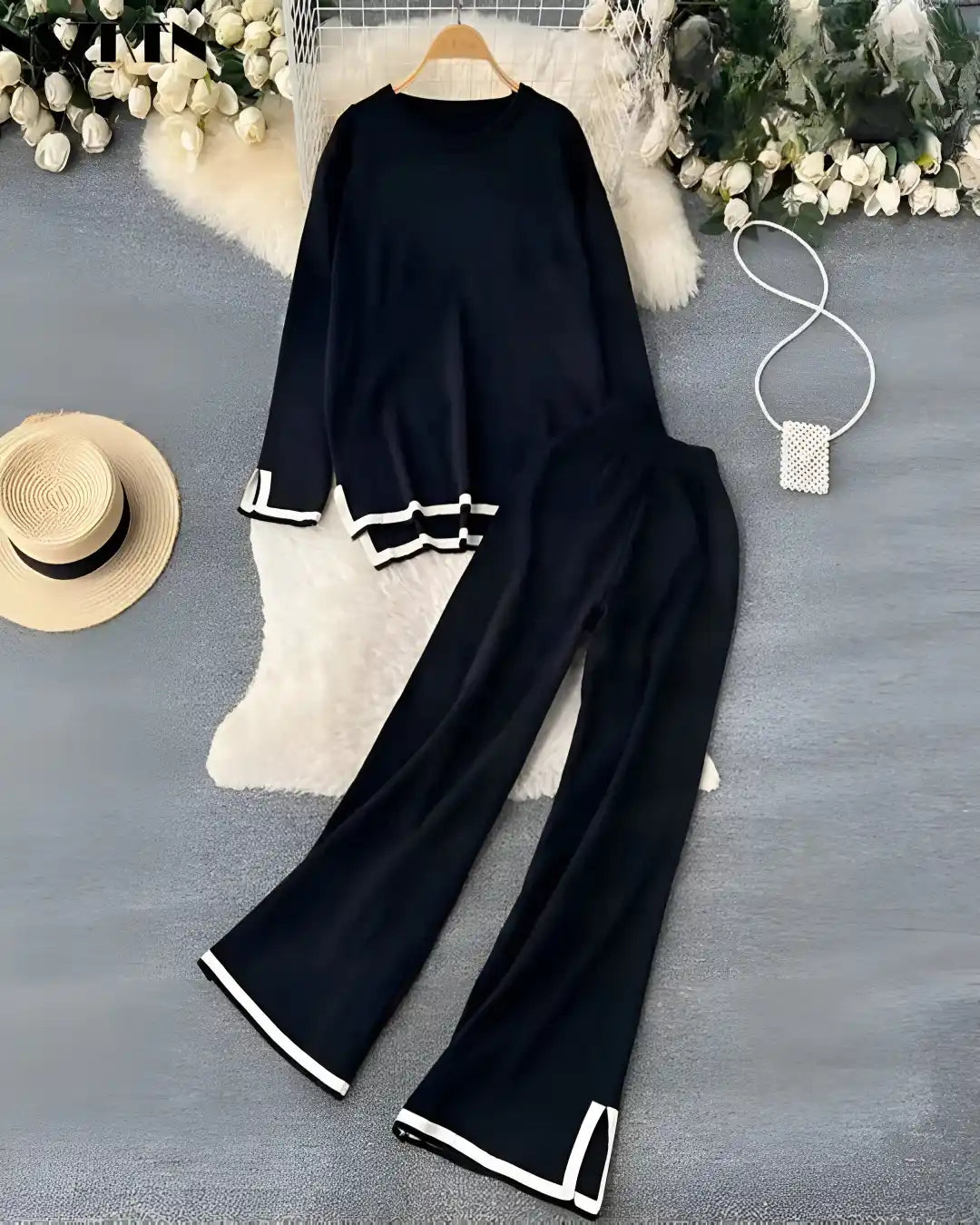 A person wearing a full-sleeve winter co-ord set with loose-fitting palazzo trousers.