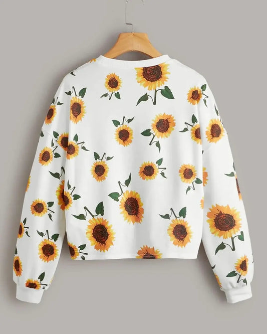 A sweatshirt with a printed winter sunflowers pattern.